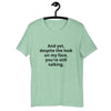 "And yet, despite the look on my face, you're still talking." - T-shirt, unisex (DT)