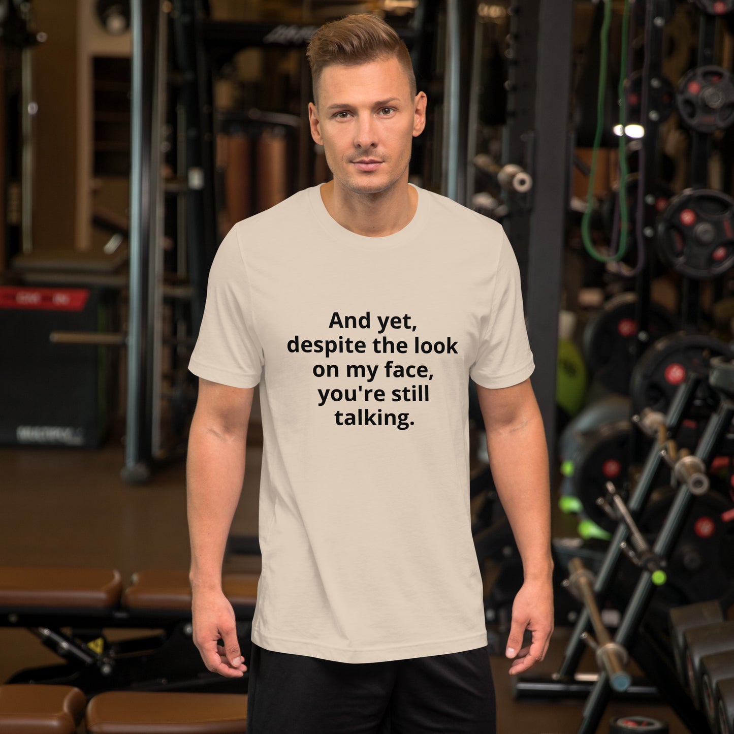 "And yet, despite the look on my face, you're still talking." - T-shirt, unisex (DT)